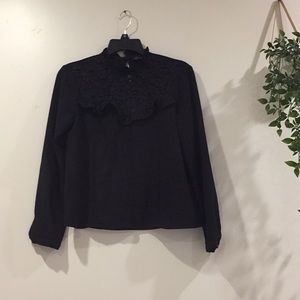 Zara black high-neck blouse.